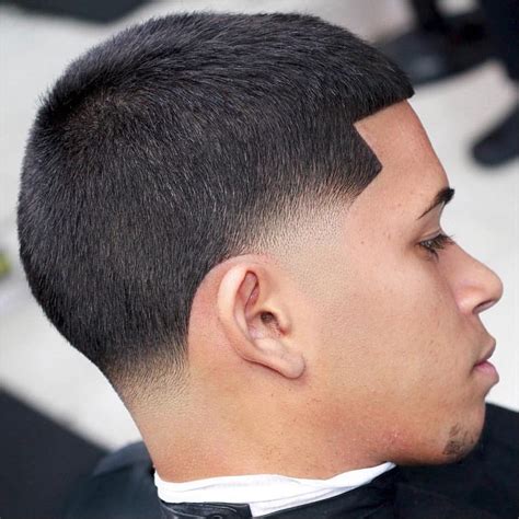 1. Low Fade. *Image from Dmarge. The low fade is the epitome of subtlety and elegance. With a gentle transition from longer hair at the top to closely shaved sides and back, this haircut exudes sophistication suitable for any occasion. What To Ask Your Barber. Request a gradual fade starting just above the ear.. 