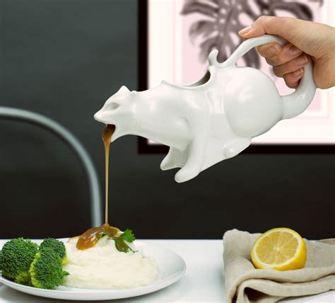 Puking cat gravy boat. <p>Choosing the right gravy boat can be quite a task. With this Puking Kitty Gravy Boat, you’ll be hailed by your fellow weirdos.</p><br /><p>If you or your guests will not be disgusted by the sight of an effigy of a cat puking their food out, this is for you. Weird as it may seem, it’s not only great for gravy, but also works perfectly for use with sauce, dressing, syrup, barbeque sauce ... 