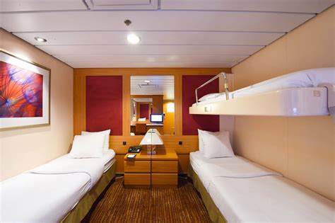 Pullman bed. A Pullman bed, also known as a wall bed or fold-down bed, is a versatile sleeping solution commonly found on Royal Caribbean cruise ships. It is designed to maximize the use of limited cabin space by allowing additional bedding options. 