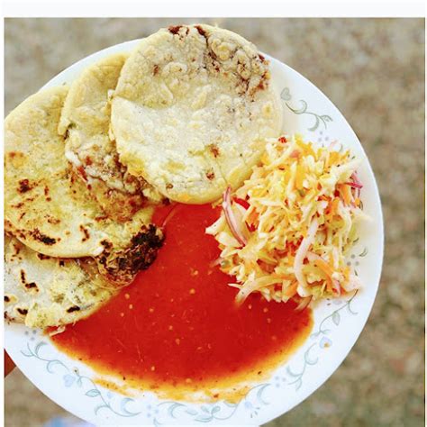 Top with another tortilla. Press the borders to close the pupusa so the filling does not come out. Add the oil to a nonstick pan over medium heat. Place the pupusas in the pan, and cook about 3 minutes on each side, until a crust forms or they are golden brown. Serve warm with curtido.. 