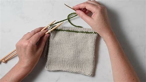 In this video I will be showing you how to do the kitchener stitch, a type of grafting stitch used in knitting, to seamlessly connect live knit stitches to k.... 