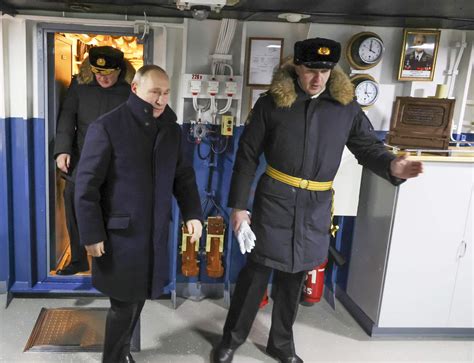Putin visits a shipyard to oversee the commissioning of new Russian nuclear submarines
