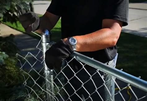 Putting in a chain link fence. Check to make sure that the string line is in proper alignment and free from any obstacles. Grab the post. Holding the level against the side of the post, gently stab the post in the center of the footing approximately a 1/4” off the string. Make sure you are on the correct side of the string. 