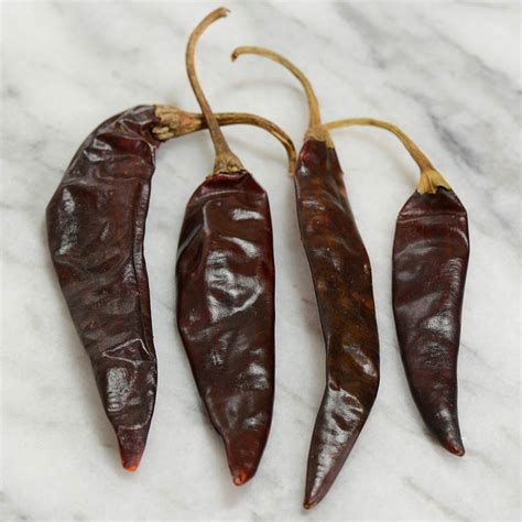 Puya peppers. Substitute. Notes. Ancho Chiles. A bit milder than Guajillo peppers, anchos are a great choice for those who want to dial down the heat. Pasilla Peppers. A popular pepper with a mild sweetness that is similar to Guajillos. Cascabel Peppers. They look a bit different but come with a rich, earthy flavor that matches well. New Mexico Chiles. 
