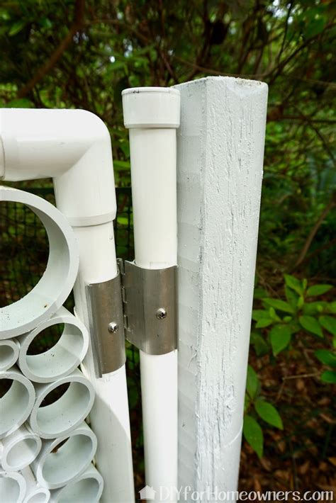 Pvc pipe gate hinge.  Using PVC pipe, we made a garden gate with decorative cuts of va...