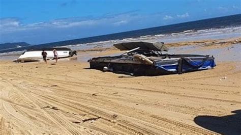 QLD flood updates: Pontoon floats away carrying crane as …