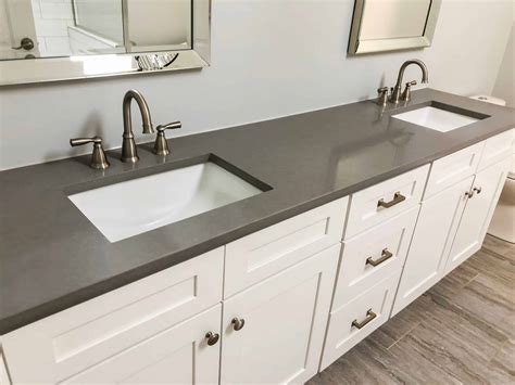 Quartz countertops bathroom. Engineered surfaces are touted for their durability, low-maintenance qualities and ability to mimic the look of a wide variety of real stone and other materials. Many new … 