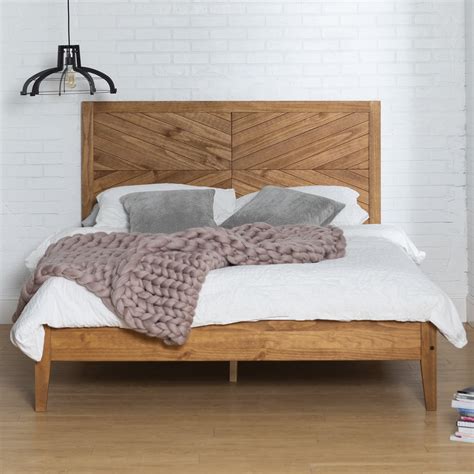 Queen bed frame solid wood. This queen-sized upholstered bed showcases clean lines and vertical channel tufting for a sophisticated look in your bedroom. Its frame is made from solid wood, and it's accented with a weathered walnut finish that complements the brown and gray polyester upholstery. The headboard is adjustable, giving you the freedom to find … 