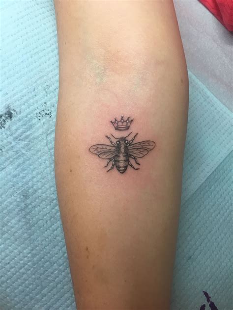 Queen bee tattoo. Dec 27, 2022 · Bee hive tattoos come in many shapes and sizes, from realistic depictions to abstract representations. Some of the more popular designs include a beehive with several bees flying around it, or an illustration of a bee hive and bees on a branch. Other common design elements include honeycombs, flowers, and hearts. 