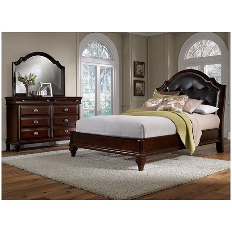 It has a simplicity and a flare all at once as if inspired by the simple gown that is confident in taking up its space. Features : Finish: Cherry. Material: Wood, Veneer (Wood), Composite Wood. Traditional Style. Sleigh Design. With 3 Slats - Box Spring is Required. Knock-Down Headboard and Footboard. Specifications :