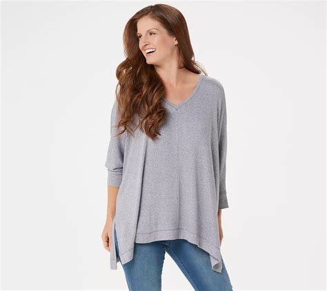 From Laurie Felt Los Angeles. Fabrication: knit. Features: pullover, long sleeves, V-neckline, solid ribbed detail at neckline, straight bottom hem and sleeve cuff. Fit: relaxed fit; generously cut with maximum wearing ease. Length: missy length 25-1/2" to 27-5/8"; plus length 28" to 29-3/4". Content: 40% rayon/30% nylon/25% acrylic/5% cashmere.. 
