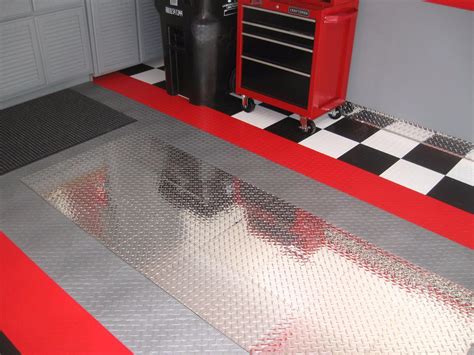 Racedeck. Our second recommendation for the best value budget garage tiles would be GarageDeck. The GarageDeck design is a coined pattern garage tile and is available in 7 different color options. GarageDeck Coin – Graphite. GarageDeck tiles are manufactured with high-impact copolymer polypropylene. 