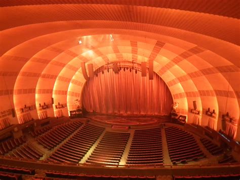 Radio City Music Hall has a seating capacity of approximately 6,000, making it one of the largest indoor theaters in the world. The seating is arranged in three main sections: Orchestra, Mezzanine, and Balcony. The Orchestra section is located on the ground level and offers a close-up view of the stage.. 