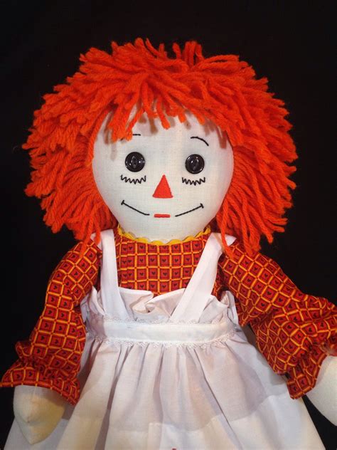 Raggedy ann orange hair. The brainchild of Johnny Gruelle, the initial patent for Raggedy Ann granted for an "all-cloth doll with shoe-button eyes, a painted face, brown yarn hair, a dress, pantaloons, a pinafore, striped legs, and black cloth shoes" in 1915. 1918. Gruelle Family Hand-Crafted. The very first Raggedy Ann was made by Johnny Gruelle's mother for his sister. 
