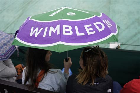 Rain again affects play at Wimbledon day but matches go ahead under the roof on Centre Court