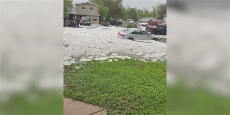 Rain and hail nearly submerge cars in Longmont