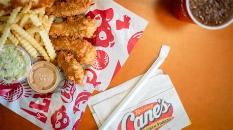 Raising Cane's is ready to open their first Michigan restaurant Tuesday morning in the heart of East Lansing. Right on the strip of shops on Grand River Avenue and the corner of M.A.C..... 