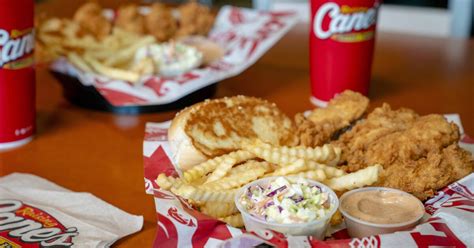 Opening Day. After finally getting the cash registers to work, Raising Cane’s opened on August 28th, 1996. It was after 9 p.m. and Todd goes out on the street to wave Customers in... business was so good, the Restaurant stayed open ‘til 3:30 a.m.! . 