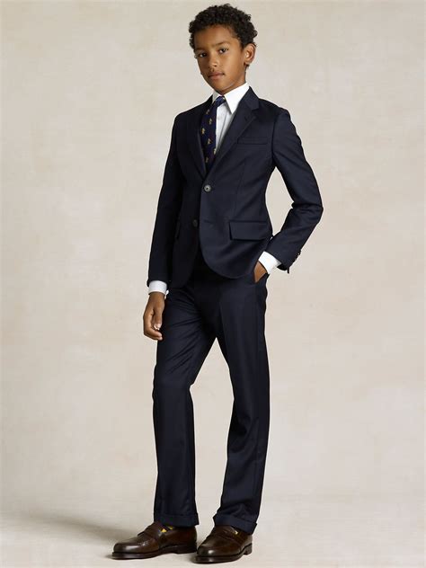 Ralph lauren boys suits. Achieve effortless style from an early age with Ralph Lauren's collection of boys’ suits and blazers. He will look cool and sophisticated in these smart tuxedos. Pair with stylish boys’ accessories a classic tie, dress socks and dress shoes for a formal look. 