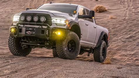 Ram 2500 build. A 5" Suspension Lift Kit featuring high strength cross members, steering knuckles, and upper control arms, is tough enough to tackle any terrain with a stance that towers above the competition. 37" Premium All-Terrain Tires complete the Black Widow wheel and tire package. Custom designed Black Widow 20" wheels are standard equipment on the … 