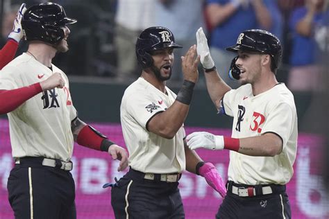 Rangers back on top of AL West after 8-5 win in opener over Mariners, and a loss by Astros