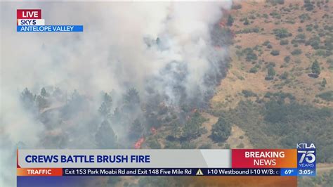 Rapidly moving brush fire spreading in Antelope Valley