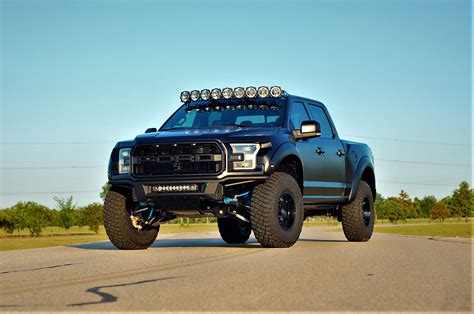 Car and Driver. The Ford F-150 Raptor is a SCORE off-road trophy truck living in an asphalt world. It wears extra-wide fenders, long-travel suspension, big tires, and the high-performance demeanor ...