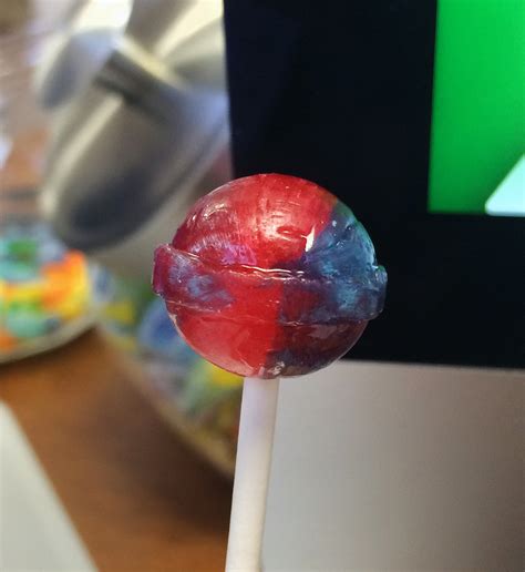 This Dum-Dum has 2 colors. It’s where they transition from one flavor to another on the production line. I believe this has something to do with the way the mystery flavor is made. I could be mistaken, but I remember reading something about them using the leftover syrup of various different flavors to create a "mystery" flavor.. 