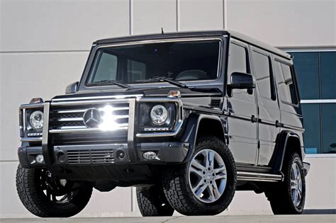 2004 Mercedes-Benz G-Class G55 AMG Offered by: Raskey Motor Co — — $26,700 5.5-Liter V8 Five-Speed Automatic Transmission Two-Speed Transfer Case Three Locking Differentials Tektite Gray/Black.... 