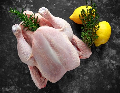 Raw whole chicken. The giblets can be cooked and used in a variety of different recipes. Do not wash the raw chicken because doing so can spread bacteria in your kitchen. Photo ... 