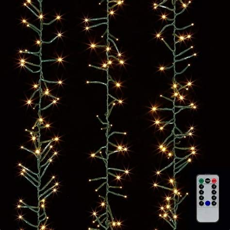 Raz cluster lights. This RAZ Imports 10' LED Cluster Light Garland + Remote With 300 Warm White LEDs on a Green Wire can be used indoors or outdoors and are perfect for Christmas, holidays, parties, or they can be used year round as decorative accent lighting. Perfect for decorating trees, garlands, wreaths, pavilions, pergolas, table themes, etc. 