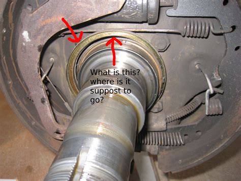 4. Tap cross pin halfway out, turn diff by hand, then pull it the rest of the way out. 5. Slide axle shafts in, and remove C-clips. 6. Slide axle shafts out. 7. Using slide hammer with axle bearing attachment (Auto Zone rents this), beat the snot out of bearings, pulling bearings and seals out. 8.. 