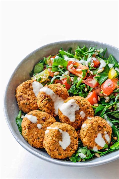 Recipe for falafels baked. Make sauce: Combine yogurt, cucumber, mayonnaise, dill, salt, and pepper in a small bowl; mix well. Chill in the refrigerator for at least 30 minutes. Make falafel: Mash chickpeas in a large bowl until thick and pasty; do not use a blender as the consistency will be too thin. Place onion, parsley, and garlic in a blender; blend until smooth. 