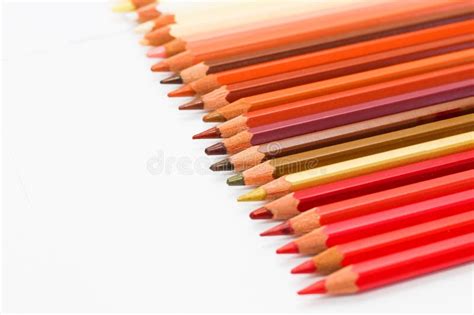 Red Pencils and a Tablet Lie on a White Sheet. Stock Image Image of