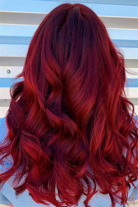 Red hair color. Bold crimson red highlights run ribbons of color up through a dark brown cafe noir base color in this balayage look. Near the ends, the crimson tones take over to create the biggest color impact for rich red tones. 16. Mahogany With Copper and Blonde Foils. Khosro/Shutterstock. 
