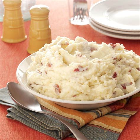 Red potato mashed potatoes. Peel and slice into large pieces. In a large pot, bring water to boil. Add potatoes. Boil for 20 minutes. Drain water and transfer potatoes to a large mixing bowl. Use a potato masher to mash potatoes until they are smooth and there are no clumps. Add heavy cream, seasoned salt and butter to mashed potatoes. 