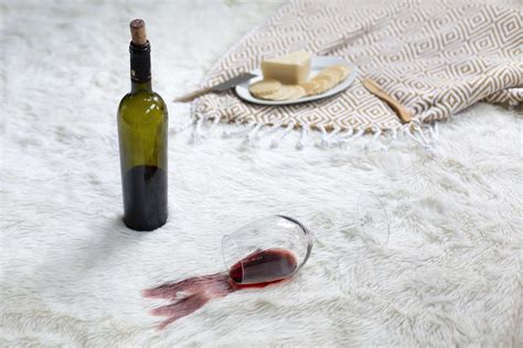 Red wine out of carpet. Vinegar and baking soda work well at lifting old stains from carpet. Pour a generous layer of dry baking soda over the old stain. In a spray bottle, combine distilled white vinegar with 1 cup of warm water. Add a few drops of liquid dish soap. Spray the baking soda area thoroughly with the vinegar solution. 