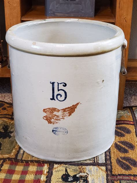 It is a #15 Red Wing with a lid and spigot. The lid has a design somewhat like a flower on top and a wooden handle in the center. There are no cracks or spider veins in the crock itself however the lid has a crack on the under side that is not visible on the top. ... Terry, your 15 gallon Red Wing crock was produced between 1915 & 1930. Now ...