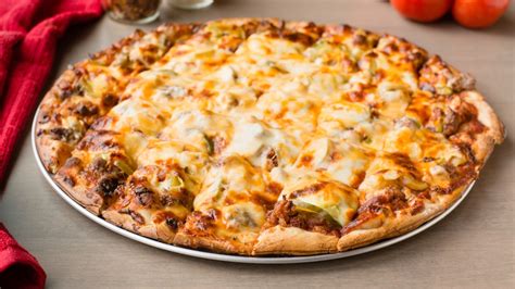 Reds pizza. Please try a different address. (change)Your Location: See Other Locations. Order Now! Red's Savoy Pizza has been serving Minnesota with an award winning 'Sota Style pizza that's loaded with toppings and covered with cheese since 1965. It's pizza with a kick! 