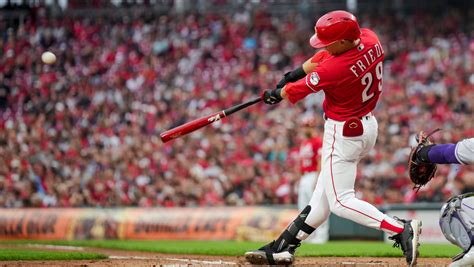 Reds push winning streak to 10 with an 8-6 victory over the Rockies