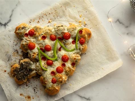 Drummond also uses store-bought ingredients in this recipe, and this time, her Pioneer woman shortcut is alfredo sauce and store-bought bread dough. It takes only 40 minutes to assemble and bake this Christmas tree pizza, and then it is ready to serve and share.. 