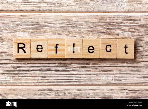 Reflect Word Written on Wood Block. Reflect Text on Table, Concept