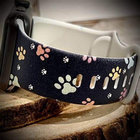 Reflex girls black paw print watch.  With its advanced calling features a...