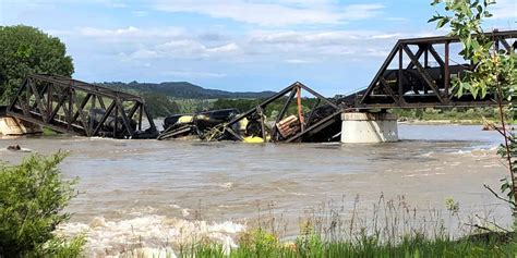 Regulators say no sign of threat from hazardous railroad cargo that plunged into Yellowstone River