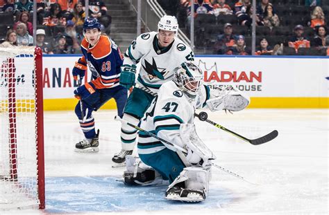 Reimer finishes with season-high in saves but Sharks lose to Oilers in OT