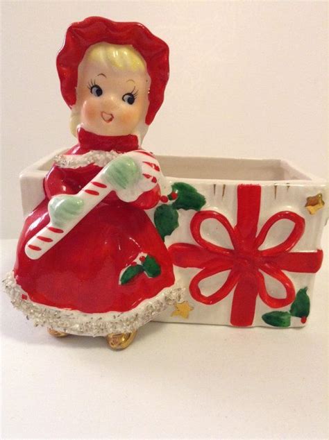 Relco 1950 Shopper Figurine Vintage Christmas shopper figurine This is a super cute collectible This little gal is dressed for the season in her ruffly gown She is off to deliver her well wrapped packages. She has no makers mark at bottom. See all photos.. 