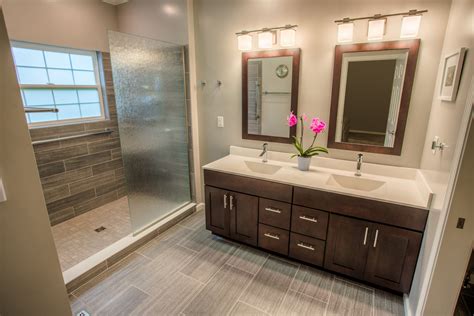 Remodel a bathroom. Remove your old bathroom floor, hardware, and disconnect the water. Prepare the plumbing for a new bathtub, replace shower controls, and address all modifications. Prepare electrical outlets for new high-end fixtures and ventilation. If you opened your walls to rewire electrical cords, secure the drywall. 