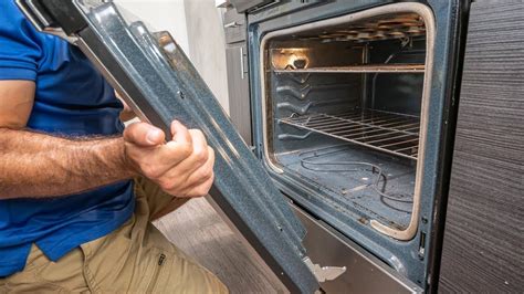 2. Open the oven door and locate the screws at the top and bottom of the door. 3. Remove the screws with a Phillips head screwdriver. 4. Pull the door away from the oven and lift …