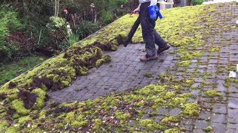 Remove moss from roof. The best way to clean moss growth off your roof surface is to first softly broom brush looser moss, leaves, tree branches and other debris. 