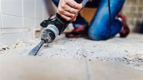 Remove tile. An oscillating tool with a narrow blade might be a better choice for grout that is particularly difficult to remove. Remember to wear safety glasses, and having a vacuum cleaner and garbage bags on hand will make keeping things clean a lot easier. After popping on your safety glasses, start by using whichever tool will best reach the grout ... 